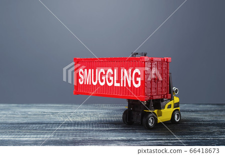A forklift truck carries a red container labeled smuggling. Transportation of illegal prohibited goods. Border control, high corruption. drugs transit, alcohol and tobacco contraband. illegal migrants A forklift truck carries a red container labeled smuggling. Transportation of illegal prohibited goods. Border control, high corruption. drugs transit, alcohol and tobacco contraband. illegal migrants 66418673