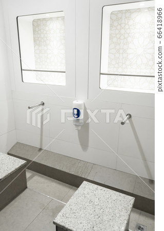 Stylish touchless washstand in a public toilet. Stylish touchless washstand in a public toilet. 66418966