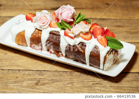 Swiss roll cake with fruit 66419536