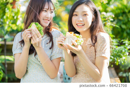 Women, eating, nature 66421708