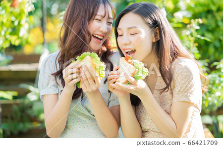 Women, eating, nature 66421709