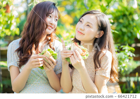 Women, eating, nature 66421712