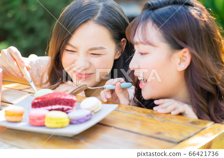 Women, eating, nature 66421736