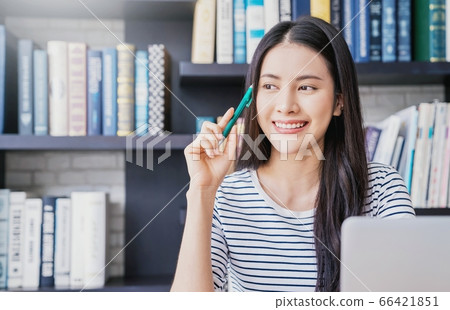 Young pretty woman library work smile laptop person material Young pretty woman library work smile laptop person material 66421851