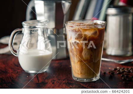 iced coffe with milk and book cafe background iced coffe with milk and book cafe background 66424201