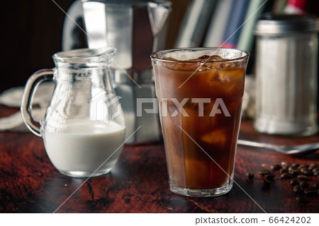 iced coffe with milk and book cafe background iced coffe with milk and book cafe background 66424202