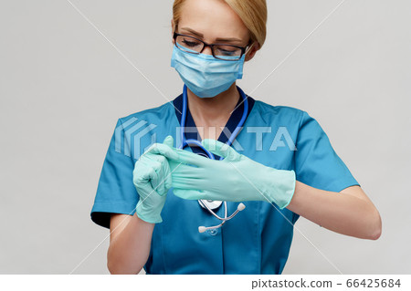 medical doctor nurse woman with stethoscope wearing protective mask and rubber or latex gloves medical doctor nurse woman with stethoscope wearing protective mask and rubber or latex gloves 66425684