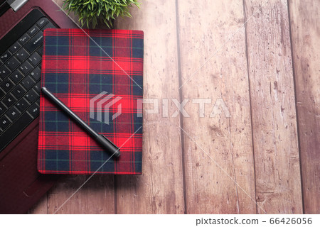 high angle view of laptop and notepad with copy space high angle view of laptop and notepad with copy space 66426056