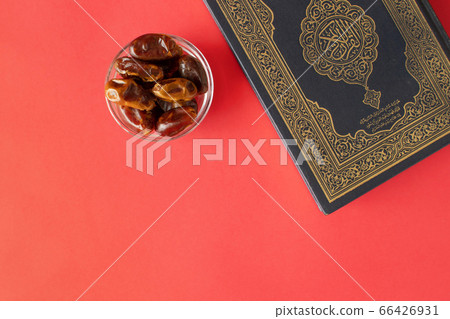 Quran on a plain burgundy background. Dates in Quran on a plain burgundy background. Dates in 66426931