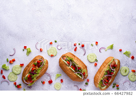 Hot dogs with sausage, sauces and vegetables Hot dogs with sausage, sauces and vegetables 66427982