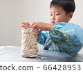 Toddler making earthenware with clay 66428953