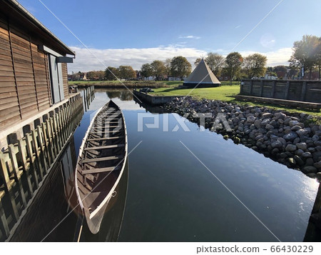 Boat and beautiful water surface. The sky is beautiful with reflection. Boat and beautiful water surface. The sky is beautiful with reflection. 66430229