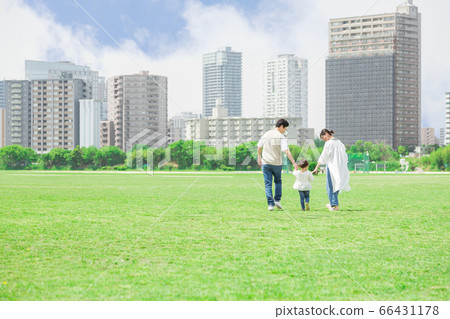 Parents and children holding hands and taking a walk outdoors (new lifestyle image) Parents and children holding hands and taking a walk outdoors (new lifestyle image) 66431178