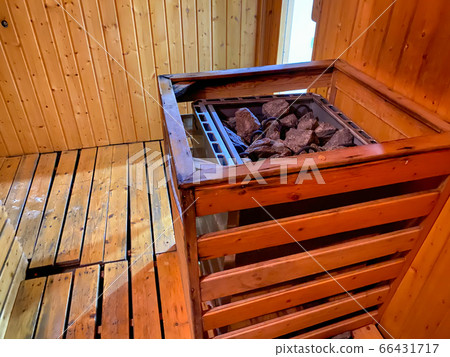 Hot stone in the wooden sauna room at the spa 66431717