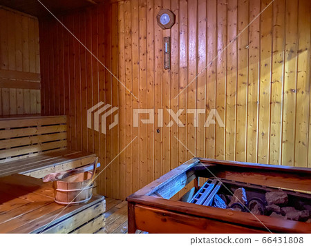 Relax sauna room with wood, heater and stones 66431808
