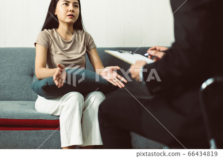 Asian woman patient talking with professional psychologist,Therapist conducting a consultation and counseling 66434819