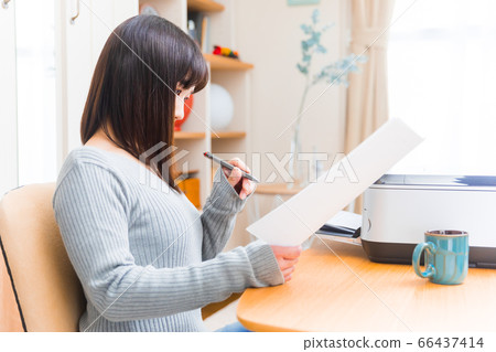 Woman checking documents Various documents Application proof Application invoice Application form Resume, etc. 66437414