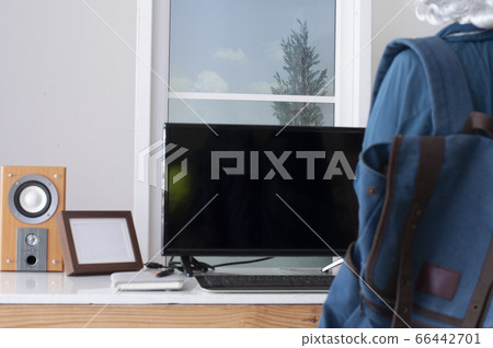 Blur background. work from home. Work Table with coffee mug. blue sky with cloud at the window. 66442701