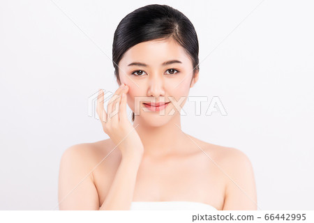 Beautiful Young asian Woman touching her clean face with fresh Healthy Skin, isolated on white Beautiful Young asian Woman touching her clean face with fresh Healthy Skin, isolated on white 66442995