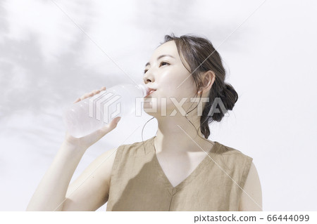 Beauty portrait of a young woman [has a plastic bottle] 66444099