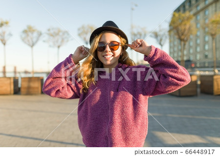 Outdoor portrait of smiling teen girl 13, 14 years old Outdoor portrait of smiling teen girl 13, 14 years old 66448917