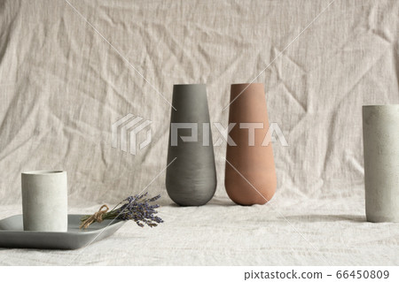 Handmade clay vases, white ceramic glasses, grey small tray with dry lavender Handmade clay vases, white ceramic glasses, grey small tray with dry lavender 66450809