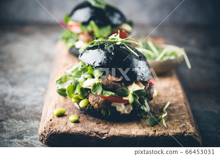Veggie mushroom black burgers. Veggie mushroom black burgers. 66453031