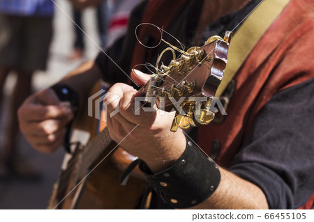street musician playing 66455105
