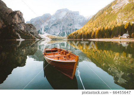 Traditional rowing boat on a lake in the Alps in fall Traditional rowing boat on a lake in the Alps in fall 66455647