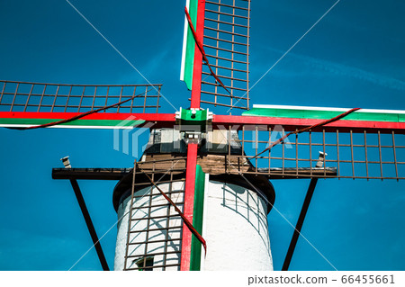 Traditional old windmill against blue sky 66455661