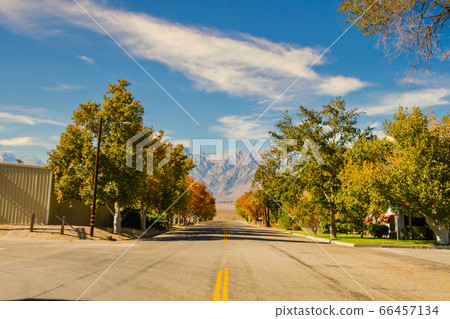 View of an empty street with Black Mountain in the background in Independence, California, USA View of an empty street with Black Mountain in the background in Independence, California, USA 66457134