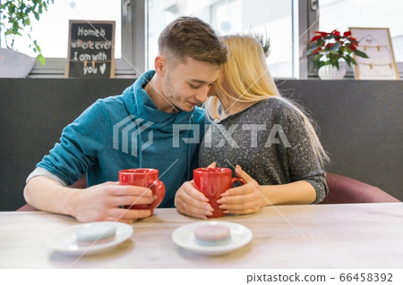 Young happy couple in love in cafe Young happy couple in love in cafe 66458392