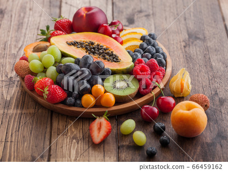 Fresh raw organic summer berries and exotic fruits Fresh raw organic summer berries and exotic fruits 66459162