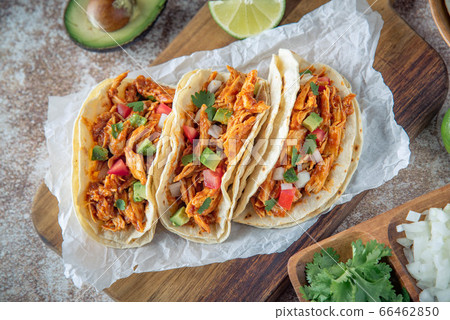 mexican shredded chicken tacos with ingredients 66462850