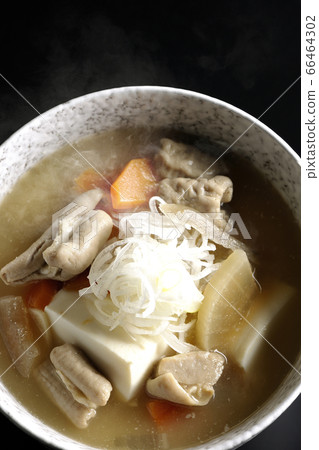 Stewed hot miso with radish, carrot, burdock root, tofu taken from a bird's eye view (black background) Stewed hot miso with radish, carrot, burdock root, tofu taken from a bird's eye view (black background) 66464302