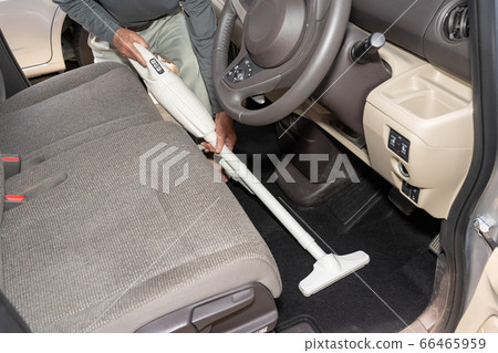 Cleaning inside the car with a cordless cleaner Front seat Driver seat 66465959