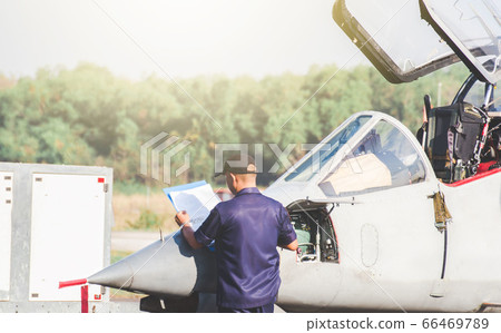 Ground personnel at the airport check of the Ground personnel at the airport check of the 66469789