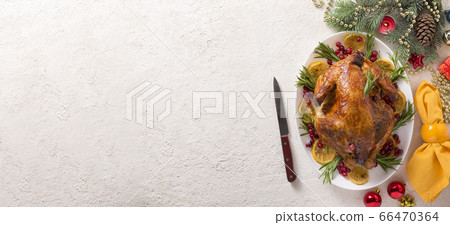 Christmas table with baked turkey or chicken, copy space for text. Christmas dinner Christmas table with baked turkey or chicken, copy space for text. Christmas dinner 66470364
