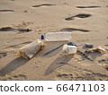 trash on sand beach 66471103
