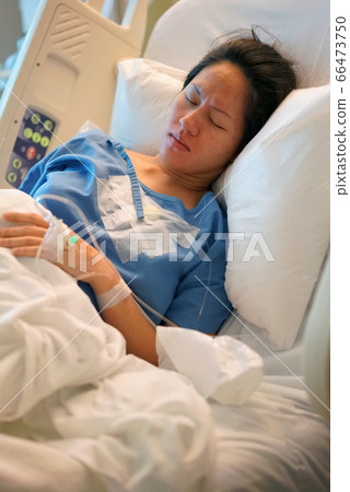Asian Chinese Woman patient lying in the hospital Asian Chinese Woman patient lying in the hospital 66473750