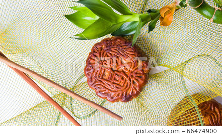 Homemade moon cakes with decorative bamboo and net Homemade moon cakes with decorative bamboo and net 66474900