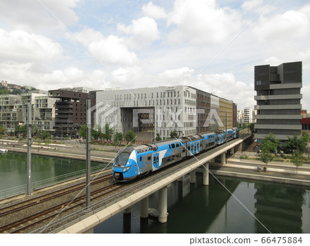 Suburban train running in the Confluence district of Lyon, France 66475884