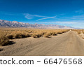 Dirt road and the Sierra Nevada mountain next to the Nikkei concentration camp of Manzanar in Independence 66476568