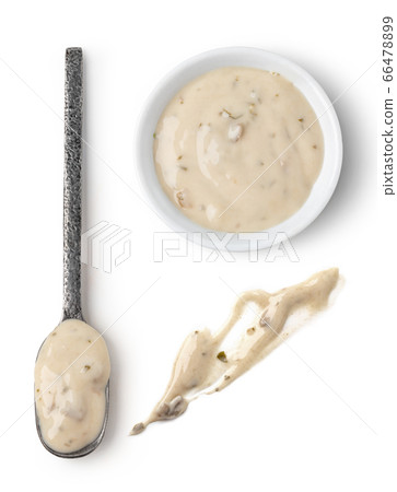 Bowl and spoon with mushrooms sauce 66478899