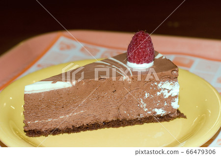 Plate with slice of tasty homemade chocolate cake 66479306