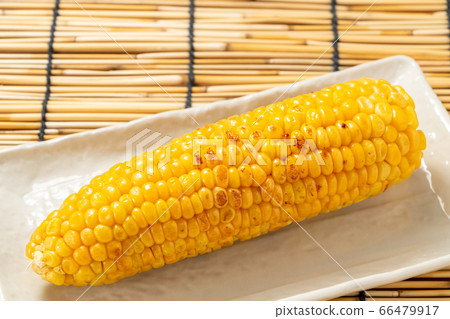 Grilled corn (grilled butter soy sauce). Summer image with a blind. Grilled corn (grilled butter soy sauce). Summer image with a blind. 66479917