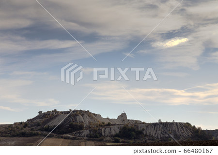 View of an abandoned quarry from the motorway. 66480167