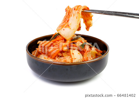 Kimchi cabbage in a bowl with chopsticks on white background Kimchi cabbage in a bowl with chopsticks on white background 66481402