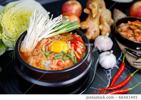 Kimchi cabbage soup in a bowl with materials of the kimchi on black background Kimchi cabbage soup in a bowl with materials of the kimchi on black background 66481405