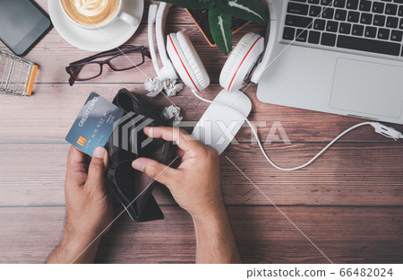 hand man open empty wallet and holding credit card hand man open empty wallet and holding credit card 66482024